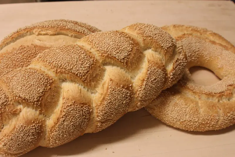 Two loaves of bread on a table.